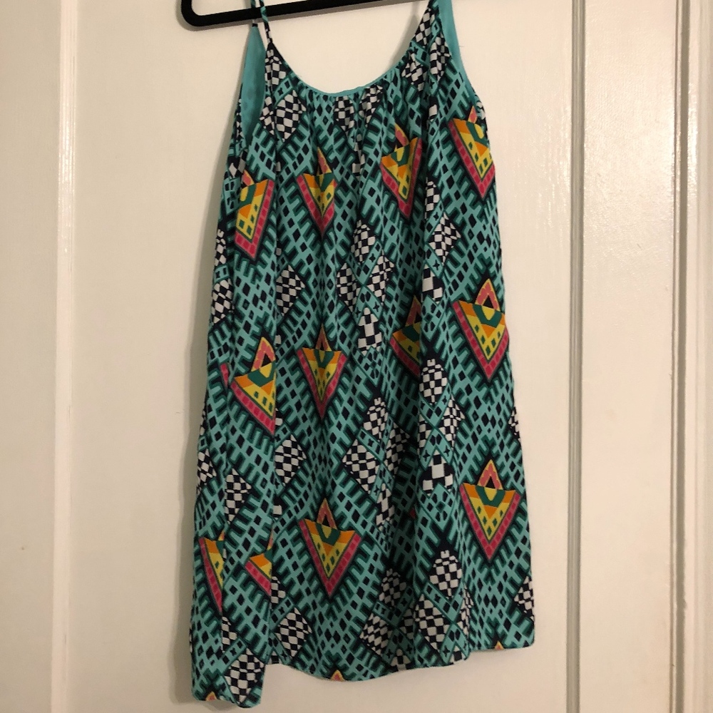 Bright sleeveless dress with low back
